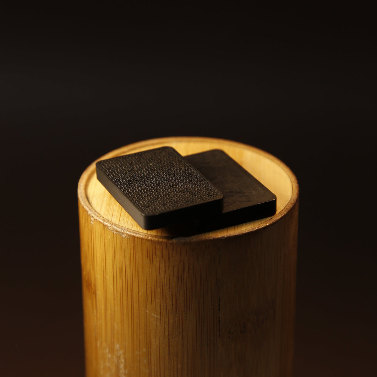 Magnetic fidget slider shown in hand for scale