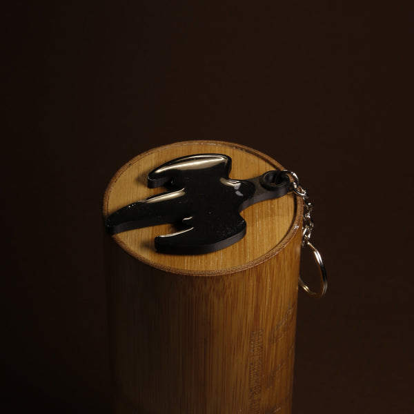 Koenigsegg ghost emblem keychain in acrylic on a plain background