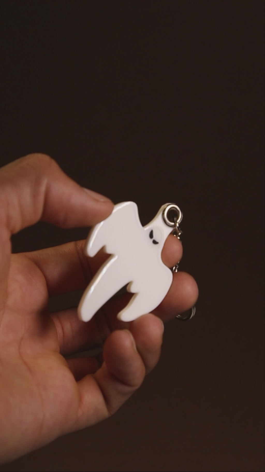Koenigsegg ghost keychain hanging from a keyring