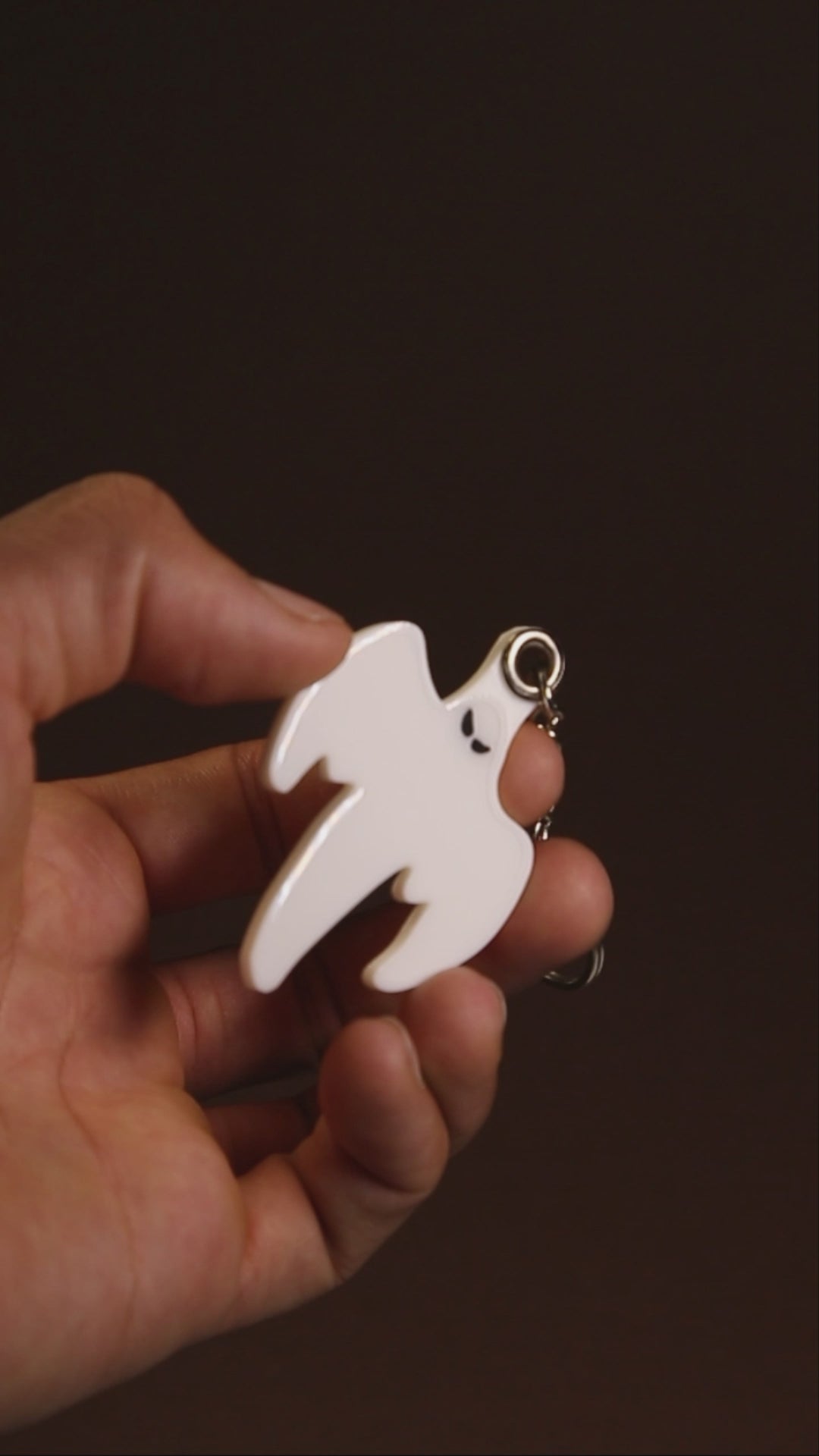 Koenigsegg ghost keychain hanging from a keyring